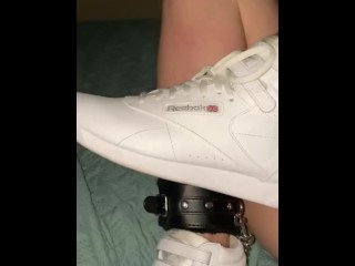 Sexy Slut loves stroking cocks with her sneakers